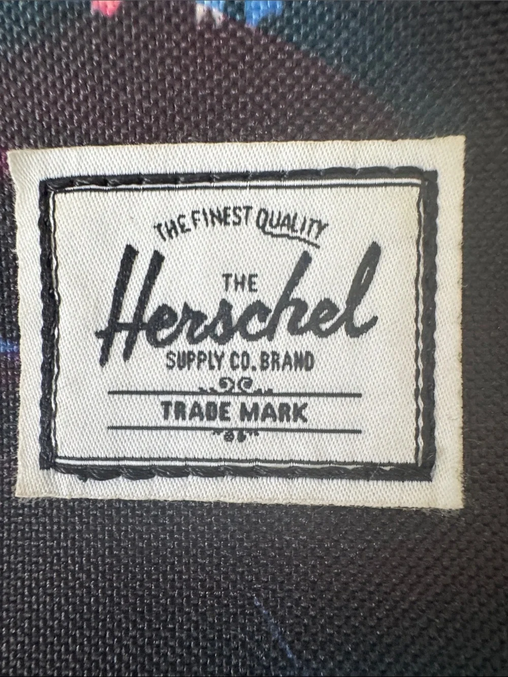 Herschel Supply Company Black Backpack with Blue and Pink Floral Accents